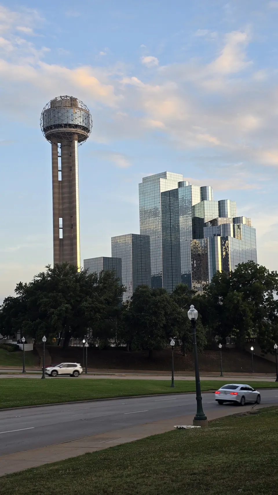 Reunion Tower beside downtown glass towers