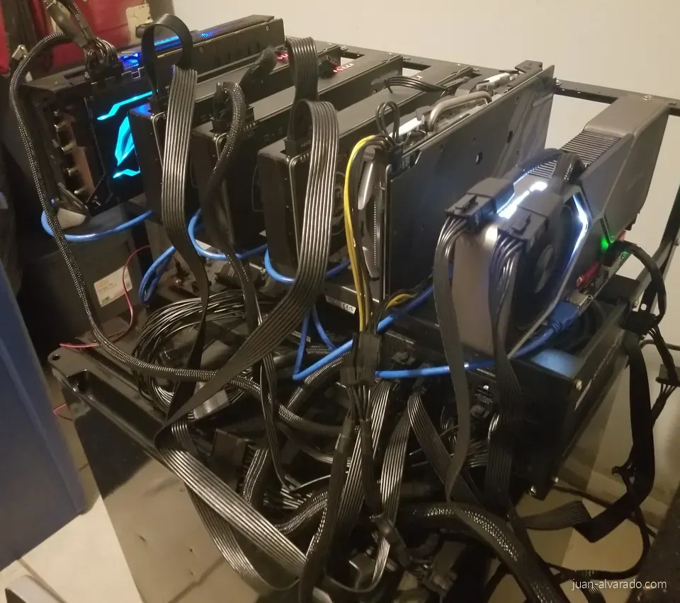 The finished rig with RGB-lit graphics cards and tidied cables