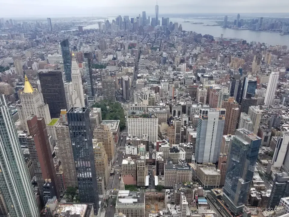 Manhattan stretching toward One World Trade Center