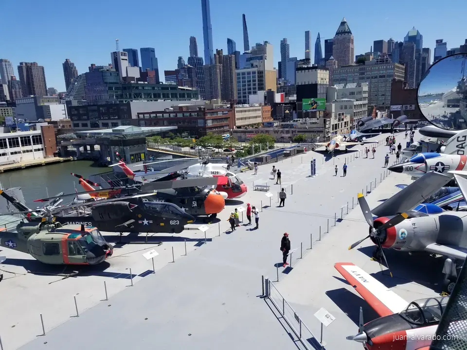 Aircraft on the Intrepid's flight deck, skyline behind