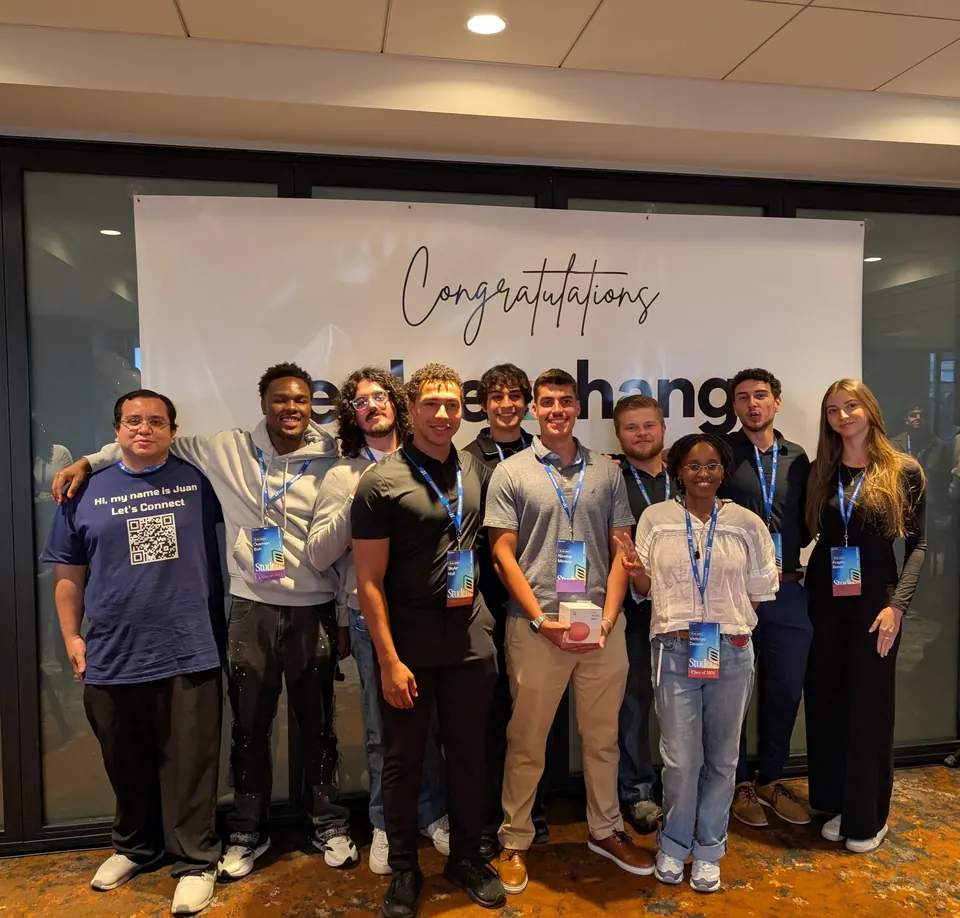 Group photo at the ColorStack Summit 2025 in front of a congratulations banner