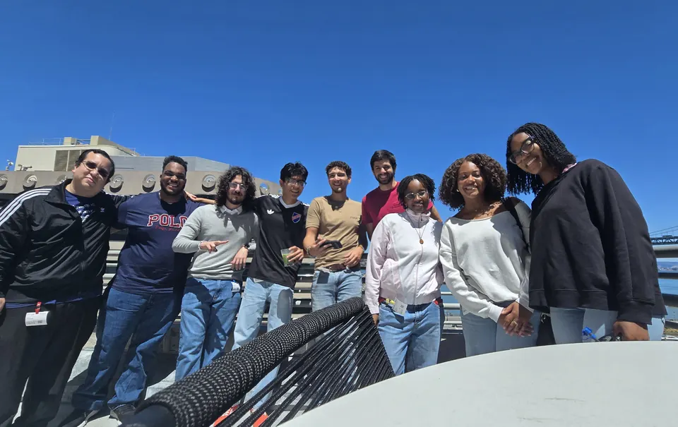 Group photo with fellow attendees on a rooftop terrace