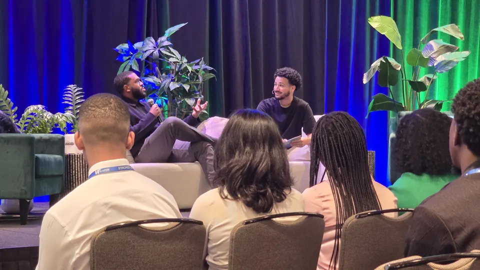 A fireside chat on stage at the summit