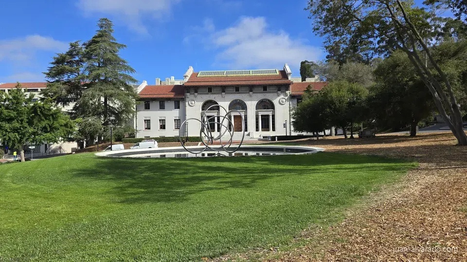 A historic campus building and lawn